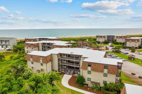 an aerial view of an apartment complex next to the ocean at Southwinds, Unit H13 in Atlantic Beach