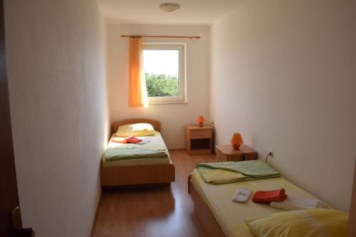Ένα ή περισσότερα κρεβάτια σε δωμάτιο στο Apartments Lavanda