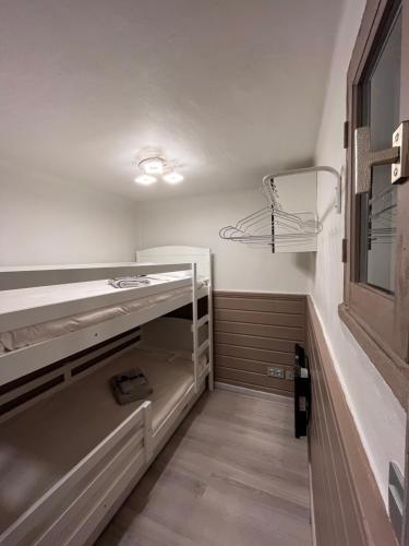 a walk in closet with shelves and a window at Le Petit Chalet Addicted to Paradise in Tignes