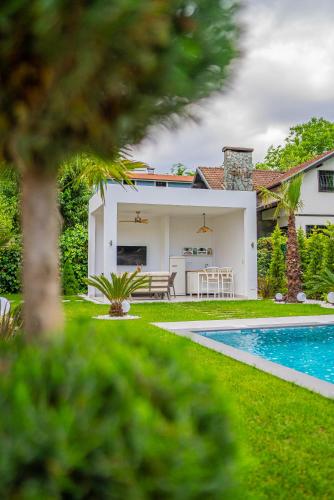 a house with a swimming pool in the yard at Terra House Sapanca in Sapanca