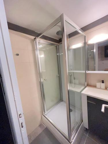 a shower with a glass door in a bathroom at Le Petit Chalet Addicted to Paradise in Tignes