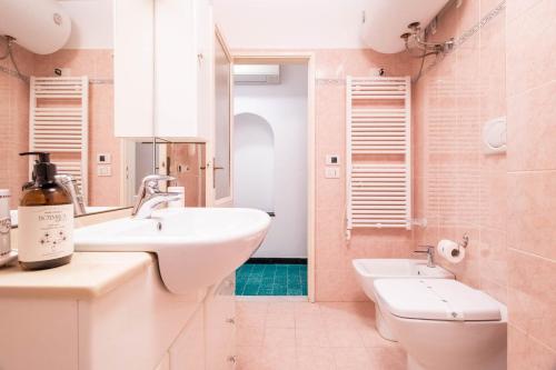 a bathroom with a sink and a toilet at Blue by PortofinoHomes in Portofino