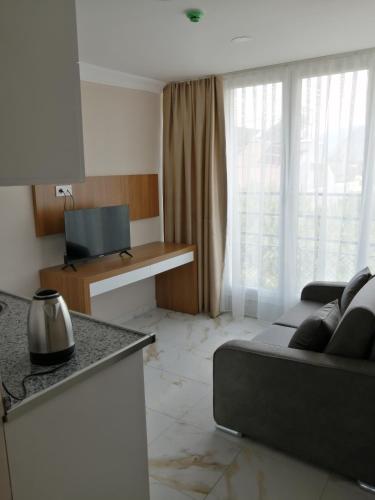 Kuchyň nebo kuchyňský kout v ubytování REGA OTEL