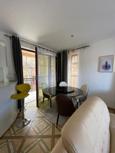 a living room with a table and a couch at Keitylin Heights Apartments in Makindye in Kampala