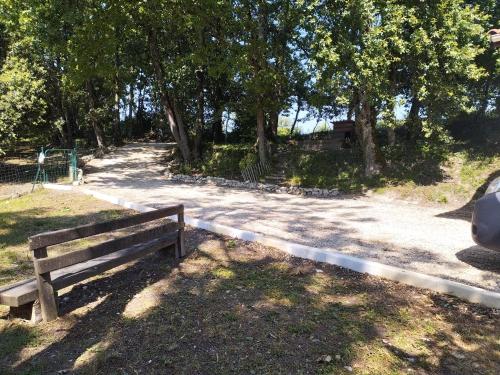 a park bench sitting on the side of a road at La Coste Blanque in Montaut