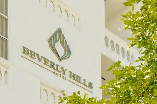 a sign on the side of a building at Beverly Hills Hotel in Mount Lavinia