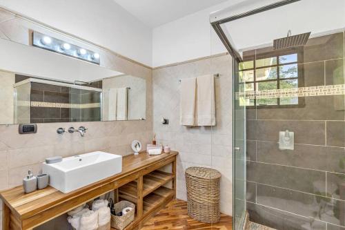 a bathroom with a sink and a shower at Casa Mojito~Serene 2 bedroom with prime location! in Tamarindo