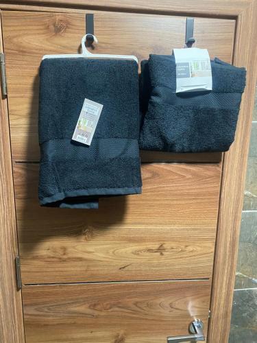 a drawer with three towels on top of it at Edelweiss Villa Trpejca in Ohrid