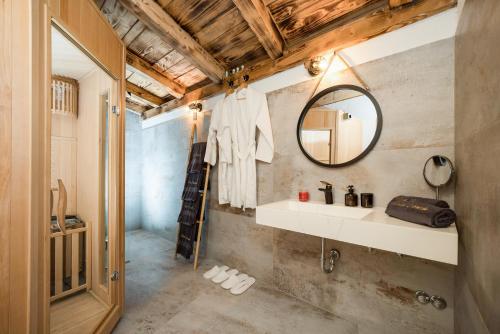 a bathroom with a mirror and a sink at Luxury Villa Cortile in Benkovac
