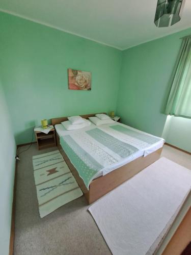 a bedroom with a large bed in a room at Apartmani Dušica in Lumbarda