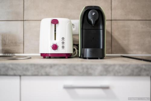 a black and white toaster sitting on a counter at Casa Dora in Suceava
