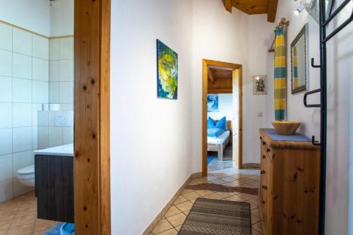 a bathroom with a tub and a toilet and a sink at Fewo Piccolo in Ebbs