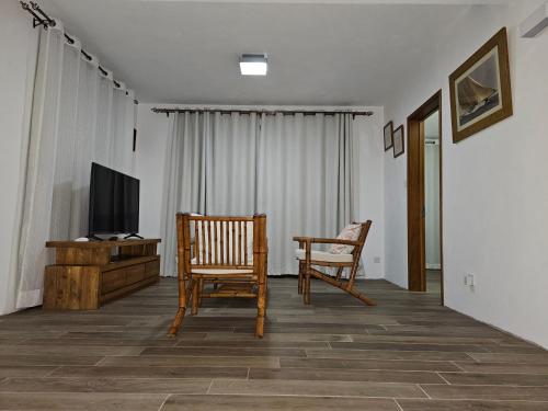 TV a/nebo společenská místnost v ubytování Villa Trochetia