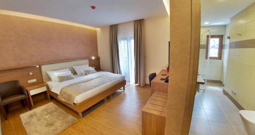 Postel nebo postele na pokoji v ubytování Hotel Mostar