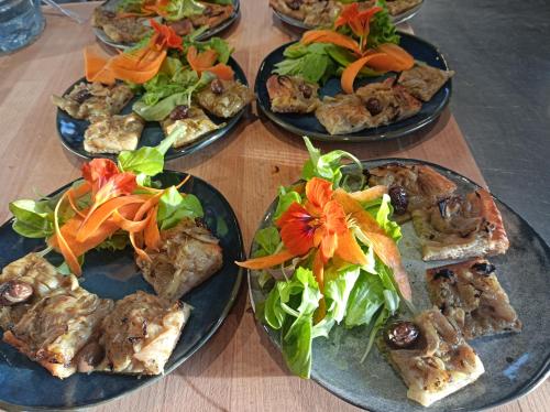 a group of plates of food on a table at Chambre d'hôtes couvent d'Alando in Alando