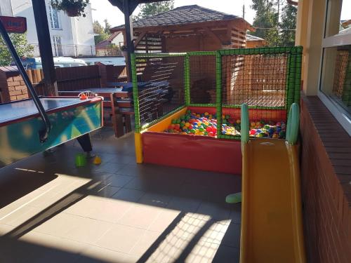 a playground with a pool and a play yard at ASIA- Pokoje Gościnne i Studia in Ostrowo