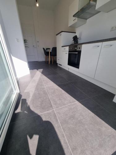 a shadow of a person standing in a kitchen at Süße Marie 3 in Karlsruhe