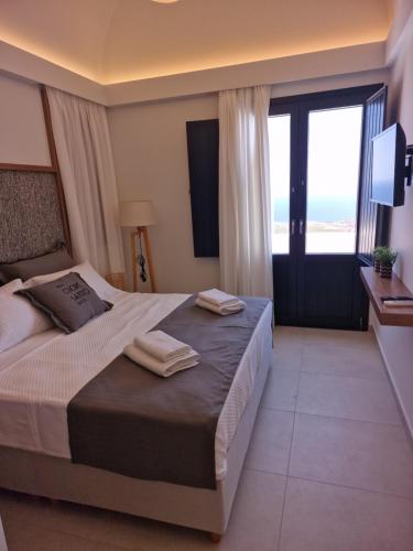Ένα ή περισσότερα κρεβάτια σε δωμάτιο στο Cuore Santo Suites
