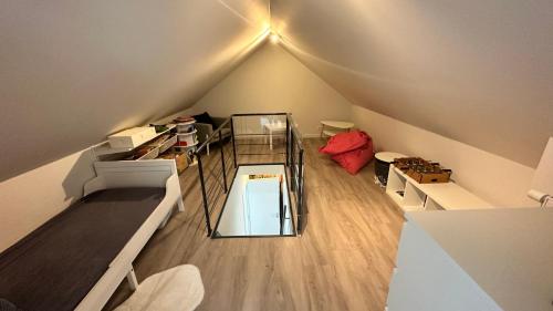 an overhead view of a room with a loft at Au petit alveo in Sprimont