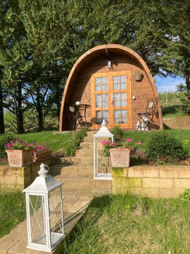 a small dome house with two lights on the stairs at Cascina Manzo in Dogliani