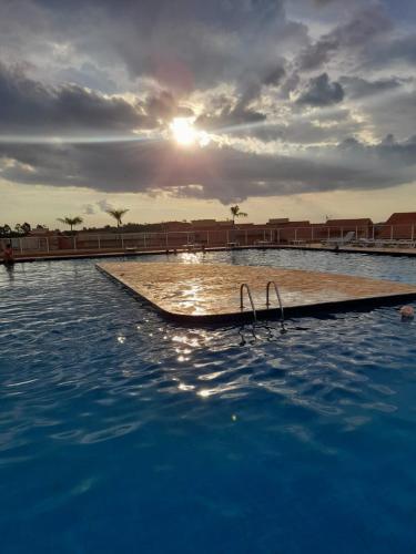 a swimming pool with a ramp in the water at Chalé em Resort in Mairinque