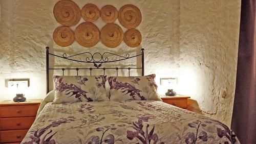 A bed or beds in a room at Cortijo AguaChá