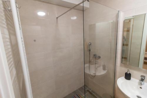 a bathroom with a shower and a sink at Gajeva Rooms - Malmö apartment SELF CHECK-IN in Virovitica