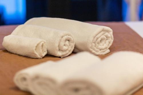 two towels sitting on top of a table at Gajeva Rooms - Malmö apartment SELF CHECK-IN in Virovitica
