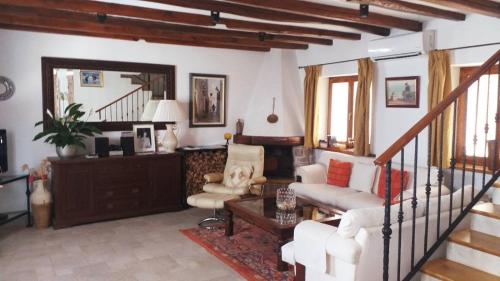 a living room with a couch and a table at Harbour Holiday Home "Vilmin Dvor" in Murter