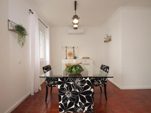 a dining room with a table with a cake on it at Forte do Ilhéu de Vila Franca in Vila Franca do Campo
