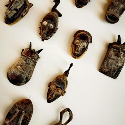 a group of artifacts on a white background at La Maison Vanille in Ngaparou