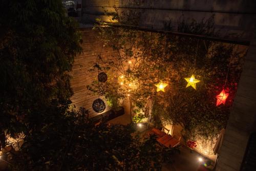 an overhead view of a garden with christmas lights at Nardazul "Casa de Sueños" in Oaxaca City