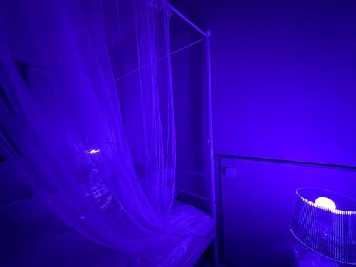 a dark room with a shower with a curtain at Beauty Apartment in Catania