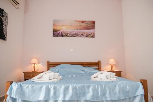 Кровать или кровати в номере Anna Maria Apartments