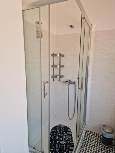 a shower in a bathroom with a glass shower stall at Alojamento Mercado Norte in Lisbon