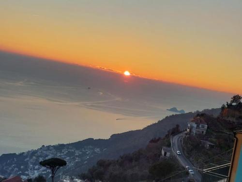 a sunset on a hill with a road on it at Furore house of Benedetta in Furore