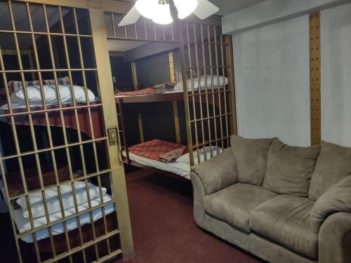 a living room with a couch and bunk beds at The King George Inn in Cobourg