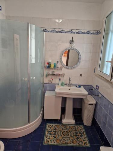 a bathroom with a shower and a sink at Appartamento Rosy in Rimini