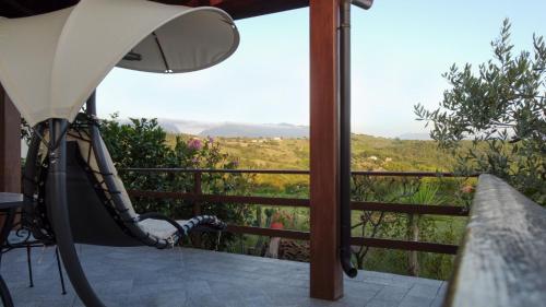 a balcony with a hammock and a view at casa di nunzia in Caiazzo