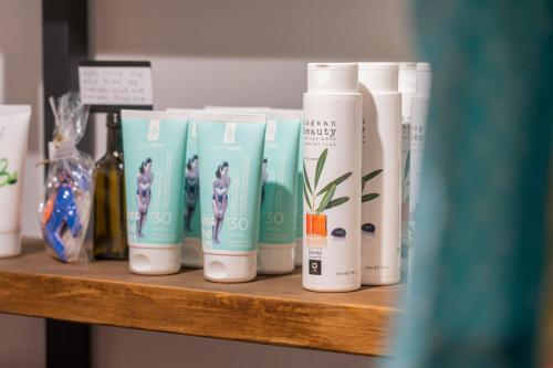 a shelf with a bunch of products on it at Anassa Cycladic Village in Galissas