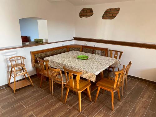 a dining room with a table and chairs at Chalupa Sviny in Sviny