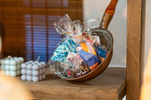 a glass bowl on a shelf with some candy at Anassa Cycladic Village in Galissas