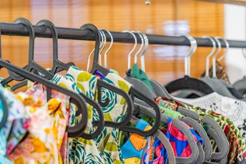 a bunch of bags hanging on a rack at Anassa Cycladic Village in Galissas
