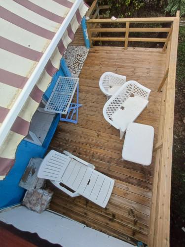 an overhead view of a deck with chairs and tables at Meryem in La Trinité