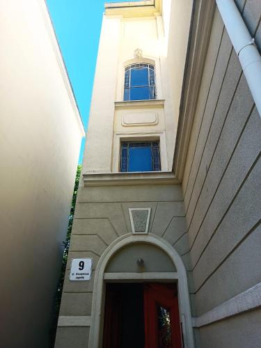a tall building with a window on top of it at Hacienda in Sopot