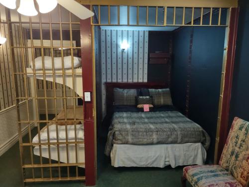a room with two bunk beds in a room at The King George Inn in Cobourg
