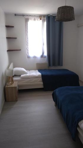 Llit o llits en una habitació de Maison avec piscine entre Chartreuse et Vercors