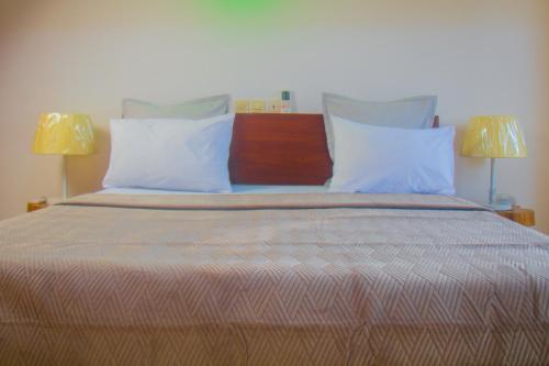 Ein Bett oder Betten in einem Zimmer der Unterkunft RESIDENCE rubis