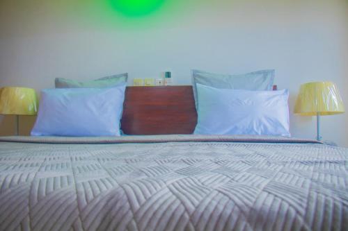 Ein Bett oder Betten in einem Zimmer der Unterkunft RESIDENCE rubis