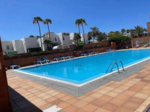 a large swimming pool on top of a building at Apartamento Kai in Playa Jandia